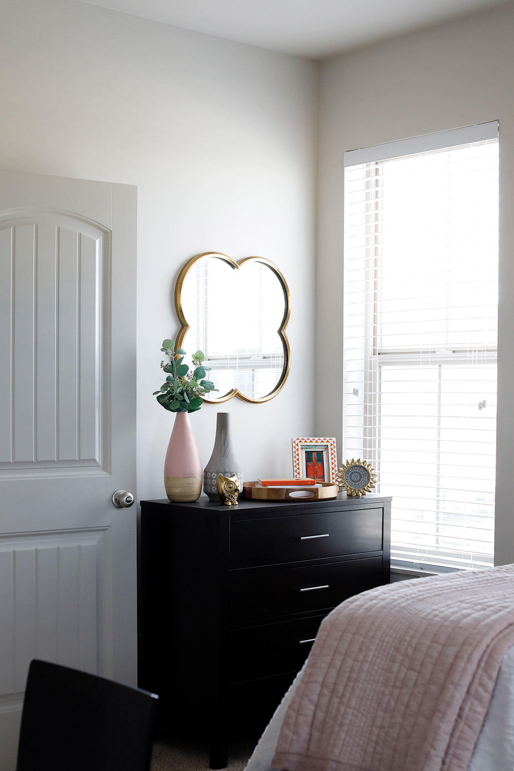 Bedroom with bed dresser and mirror