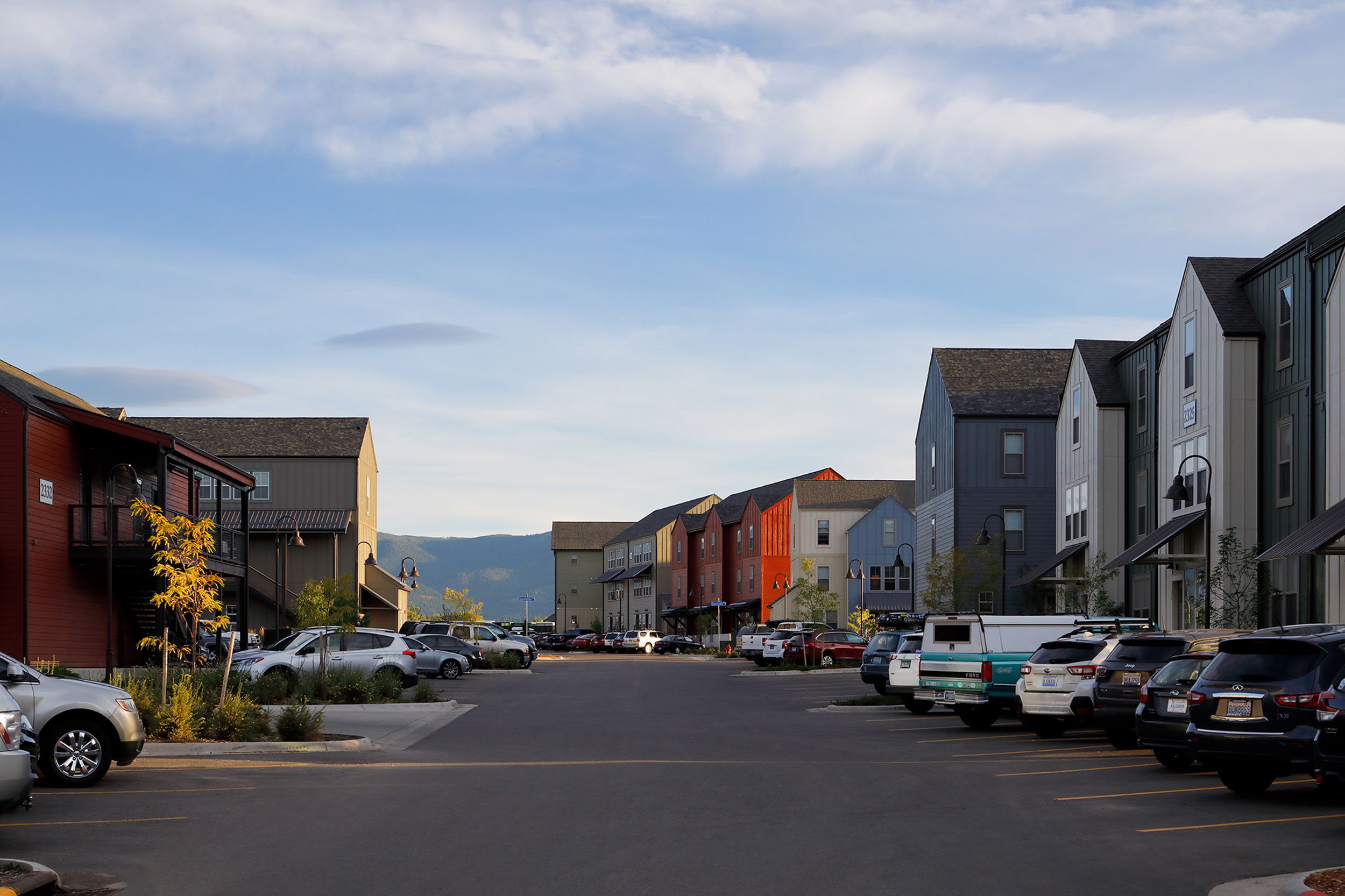 Parking lot surrounded by apartment and townhome buildings