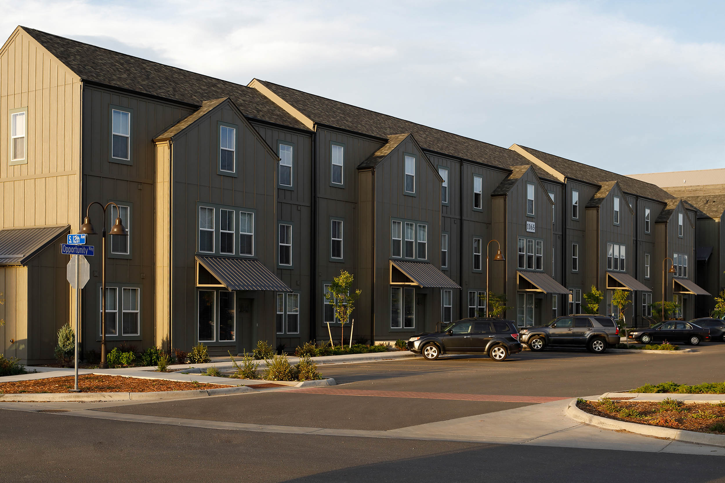 Row of apartments in brown gray three story building