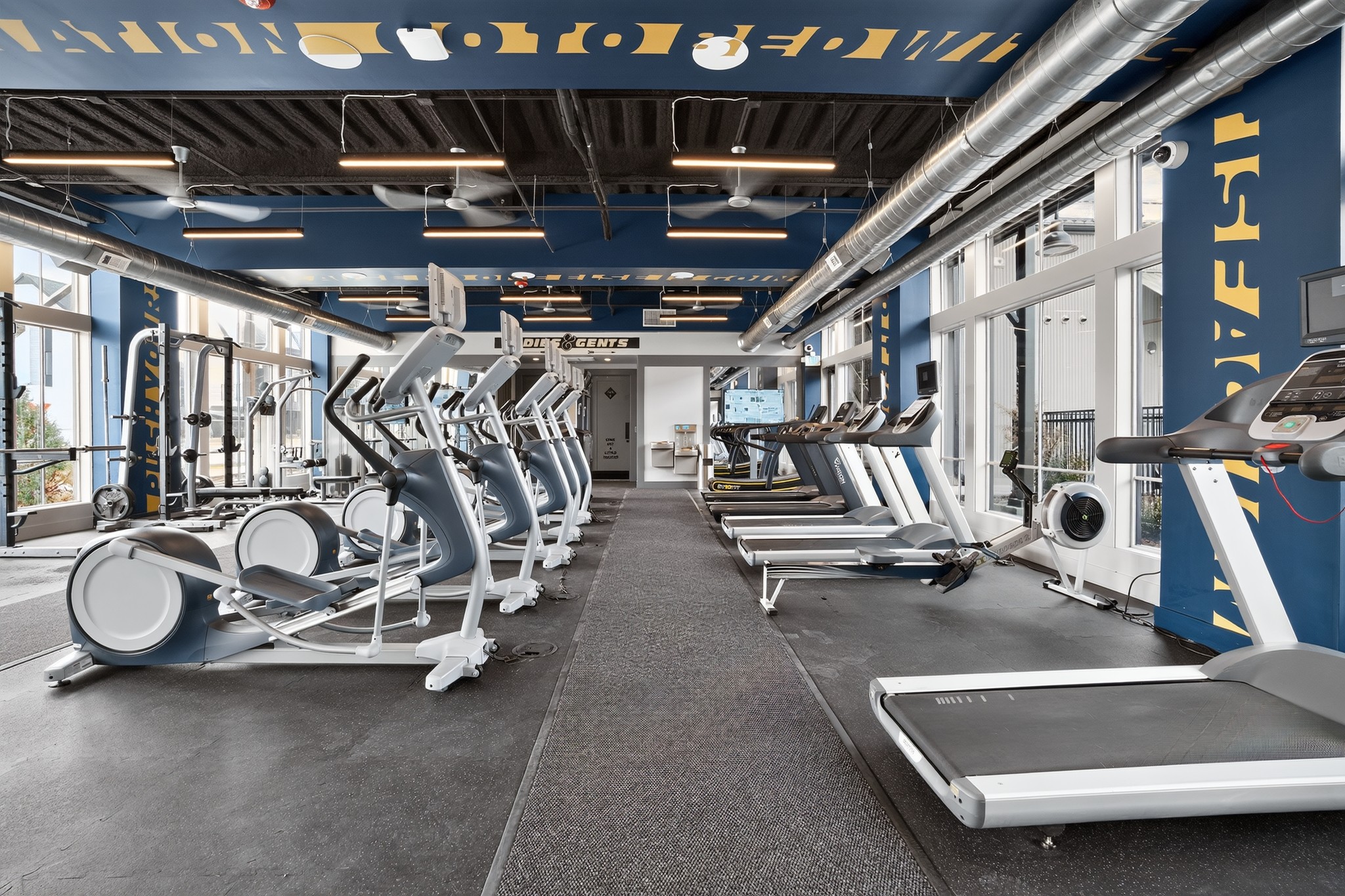Fully equipped fitness center with lots of natural light
