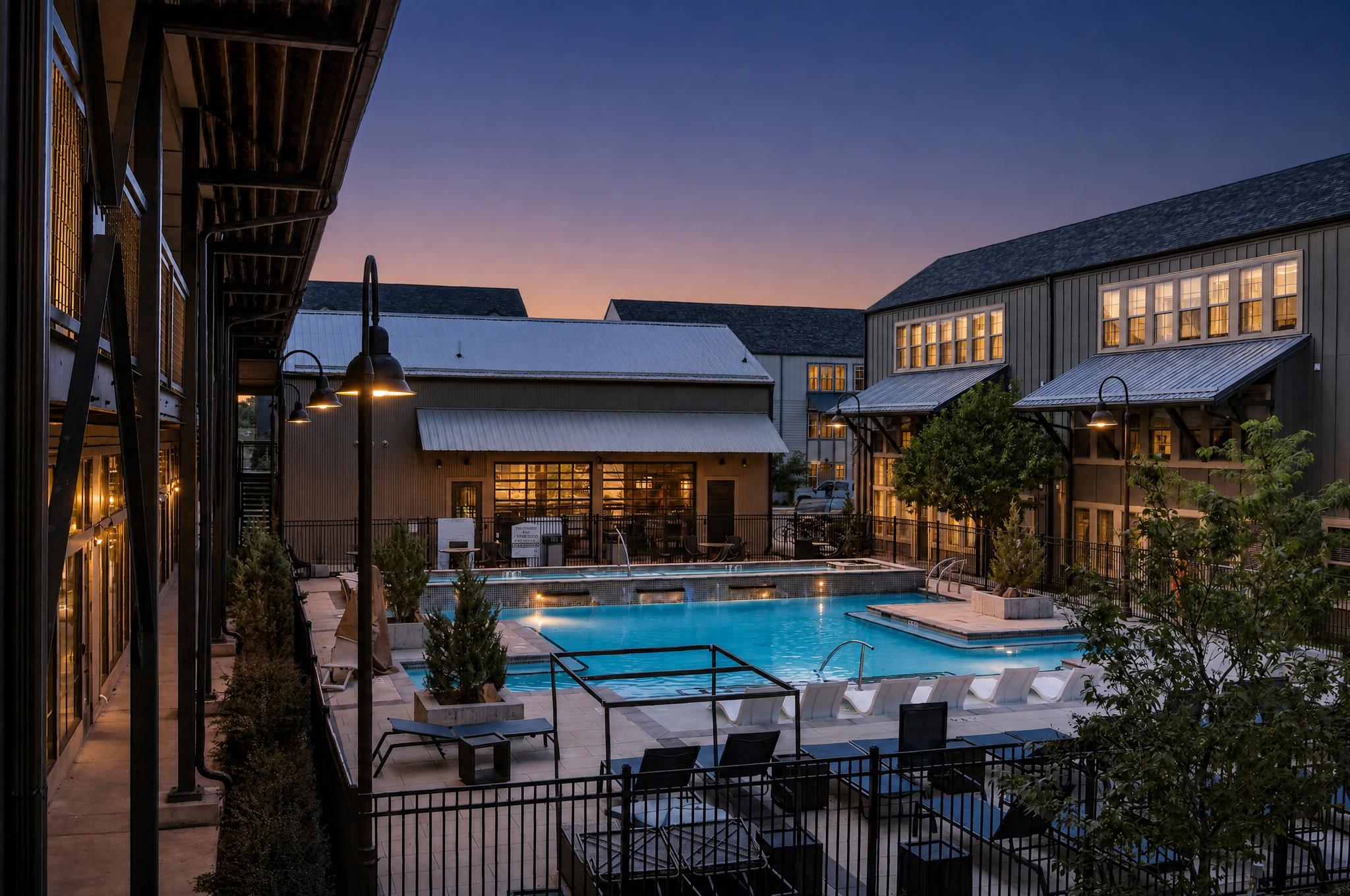 The Arrow's resort-style swimming pool and hot tub at sunset